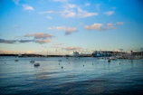 Vessels anchored in Klaipeda harbor under a clear sky.