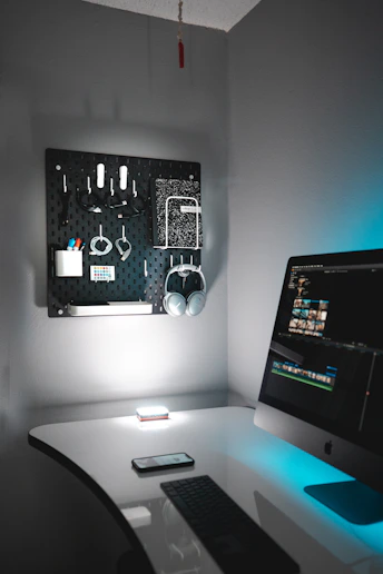 A sleek, modern home office with neatly arranged tech gear and calming decor.