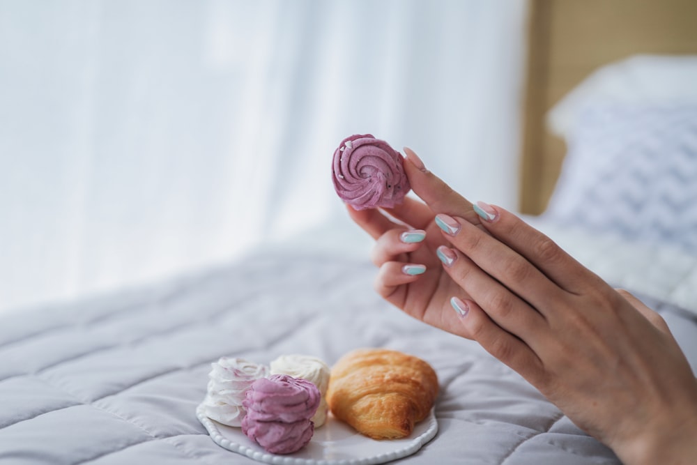 person holding cupcake