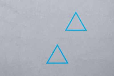 two blue triangle logos triangle teams background