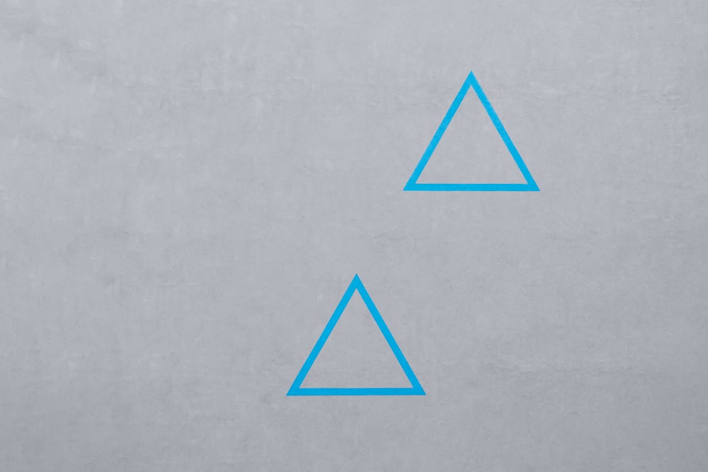 two blue triangle logos