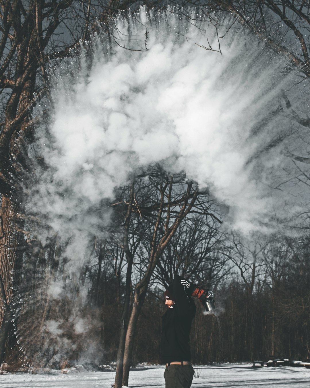 man throwing snow upward