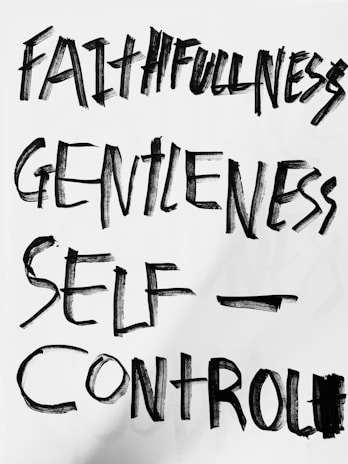 The image features bold, hand-painted words in black on a white background. The words 'Faithfulness', 'Gentleness', and 'Self-Control' are prominently displayed in an expressive brushstroke style.