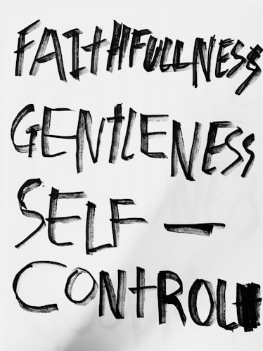 The image features bold, hand-painted words in black on a white background. The words 'Faithfulness', 'Gentleness', and 'Self-Control' are prominently displayed in an expressive brushstroke style.