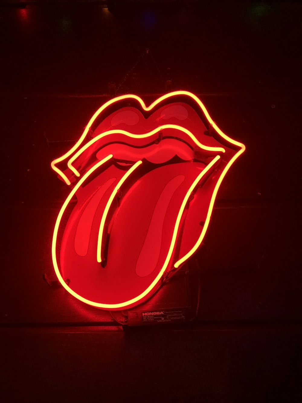 red tongue out neon light signage turned on