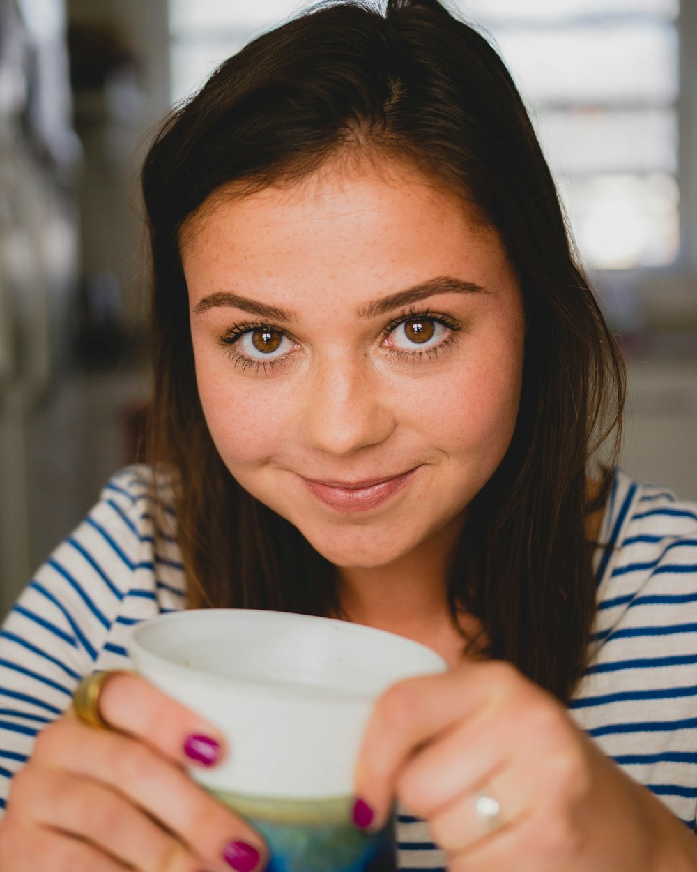 woman holding cup