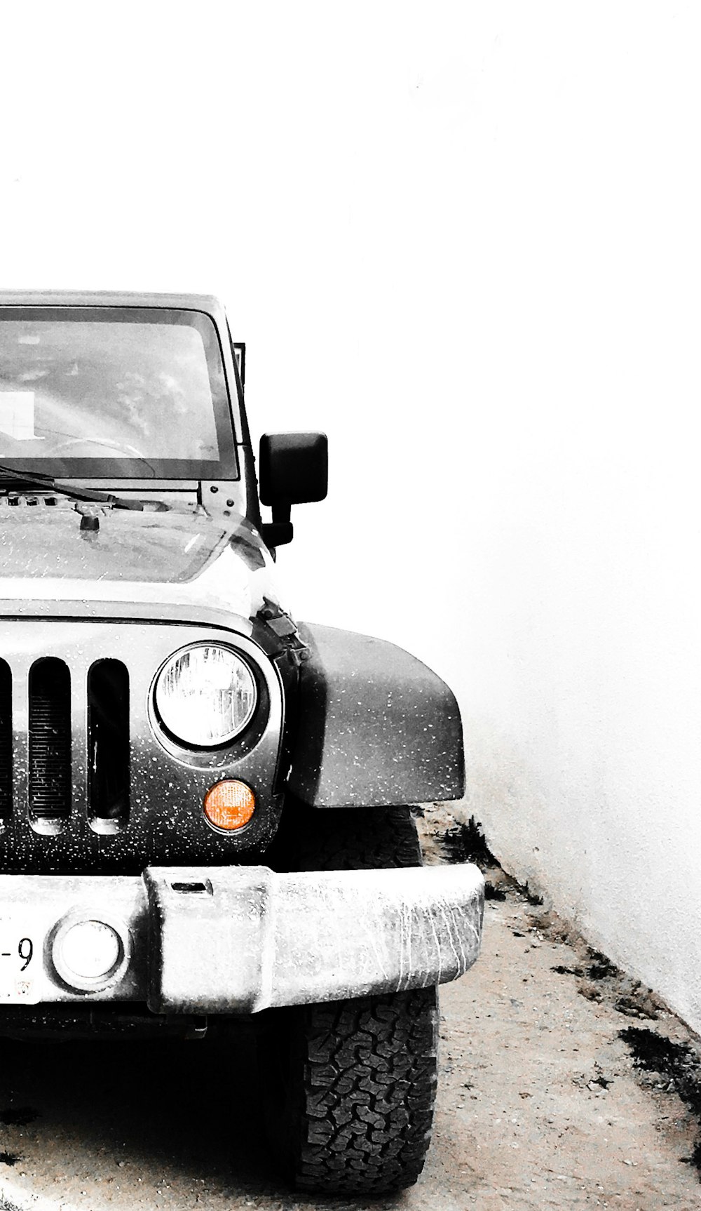 grey Jeep Wrangler on snow-covered ground during daytime