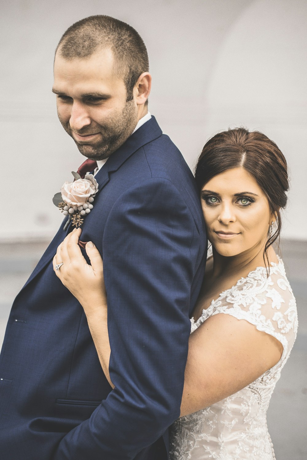 a bride and groom posing for a picture