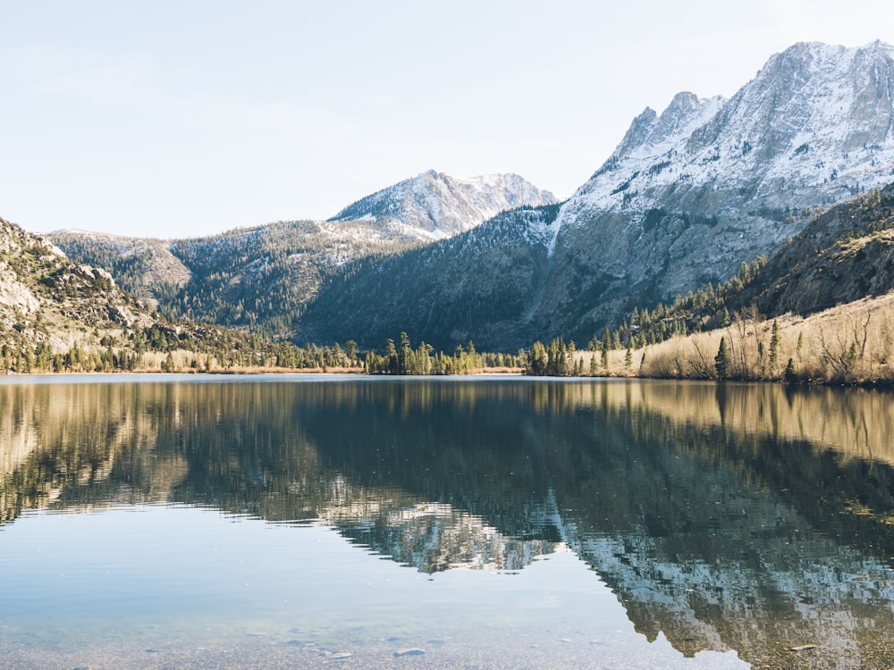 gray mountain near lake during daytime