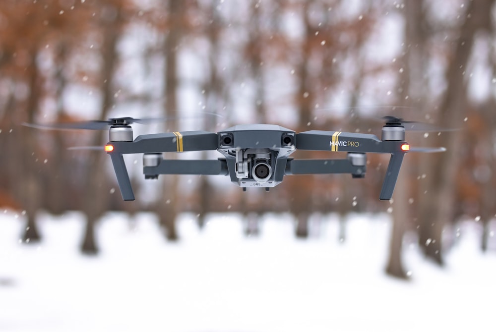 selective focus photography of gray DJI Mavic Pro floating during daytimer