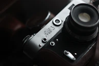 Close-up detail of a vintage camera with artistic shadows.
