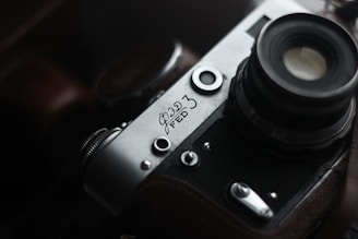 Close-up of a finely detailed 3D-printed miniature of a vintage camera, showcasing intricate textures and hand-painted accents.