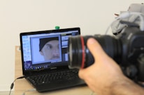 Close-up of a digital artist retouching a lingerie photo on a computer screen.