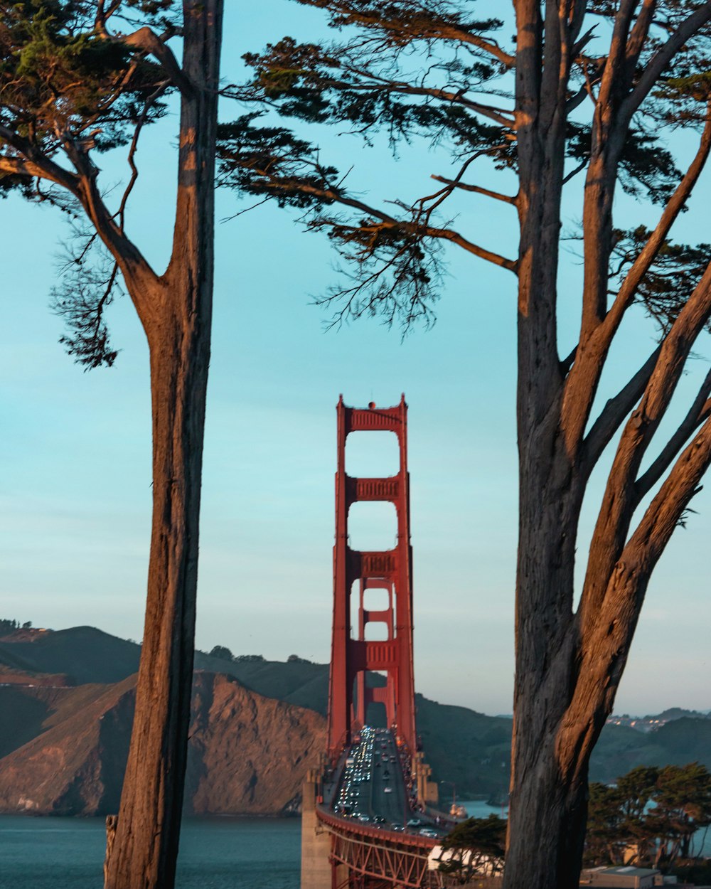 vehicles passing on Golden Gate Bridge during daytime