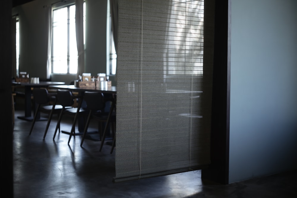 venetian blinds ins half covering an open door