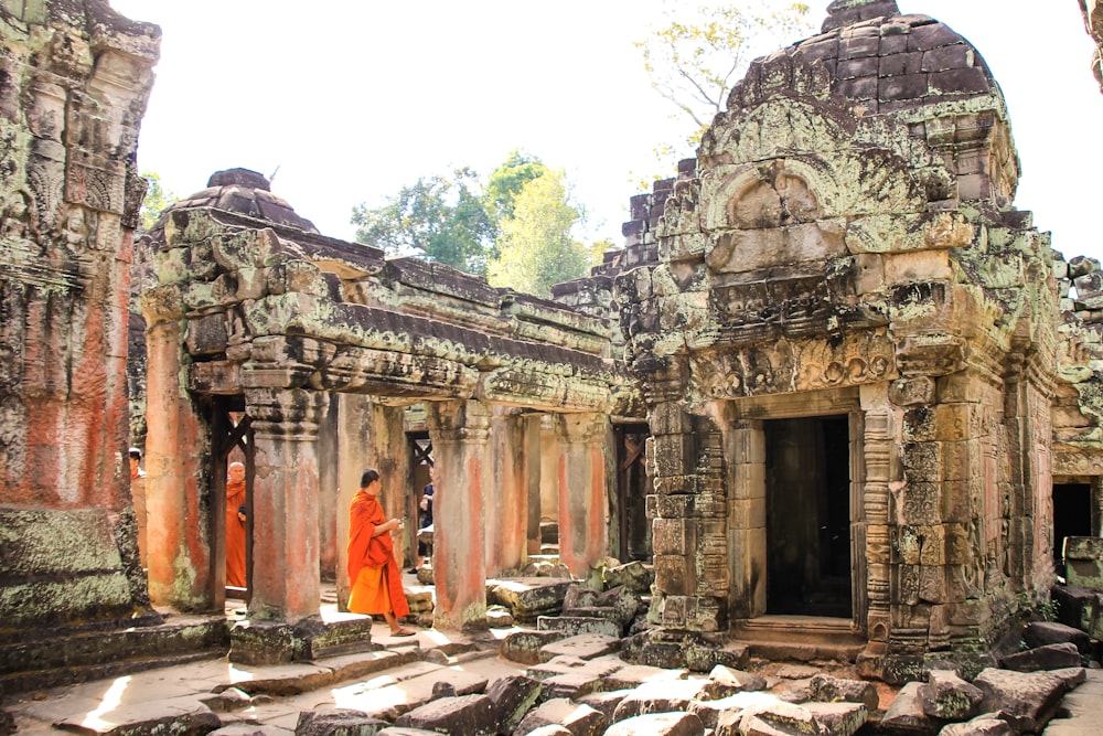 people walking inside ancient temple during daytime
