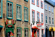 Street view of a historic building in Kadıköy with vibrant local shops.