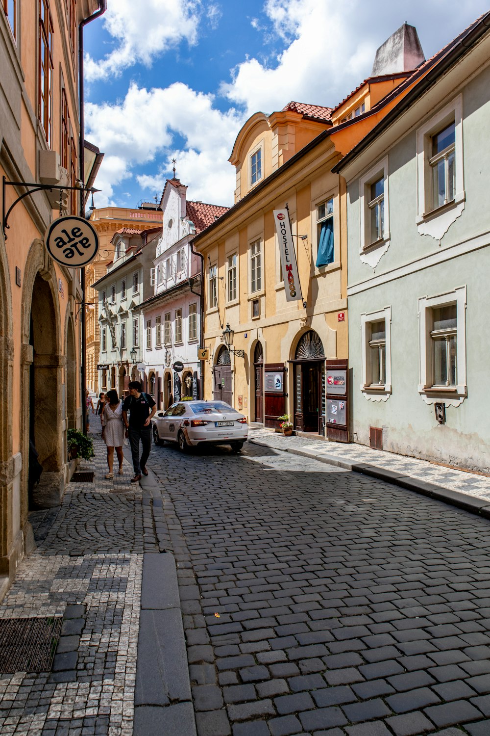 white car on streets during daytime