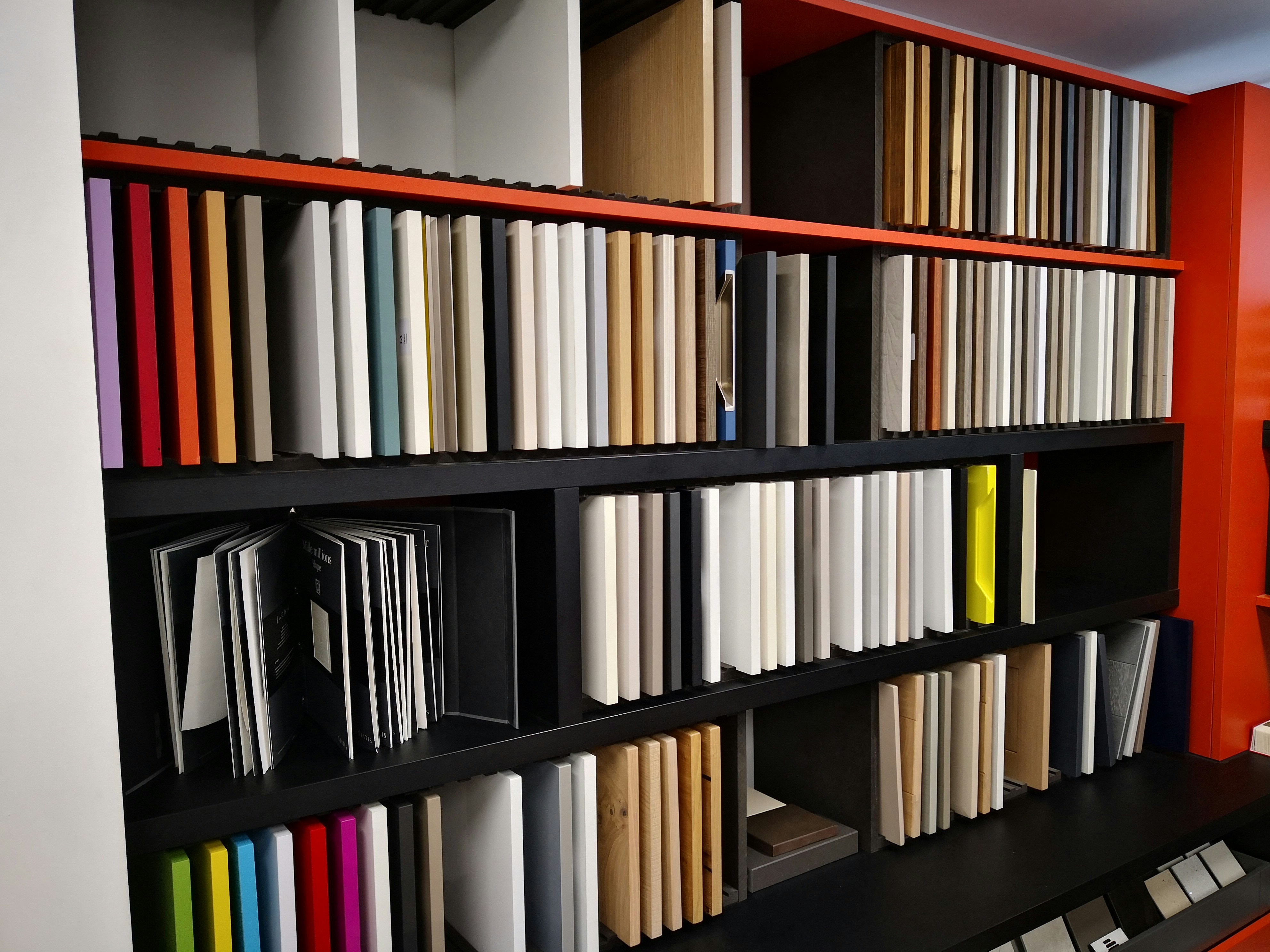 books on black and brown wooden shelf