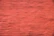 Close-up of a smooth, glossy wall freshly painted in a warm, inviting shade.