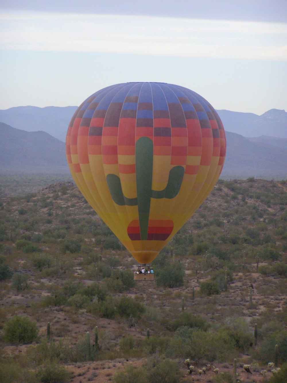 people riding hot air balloon during daytime