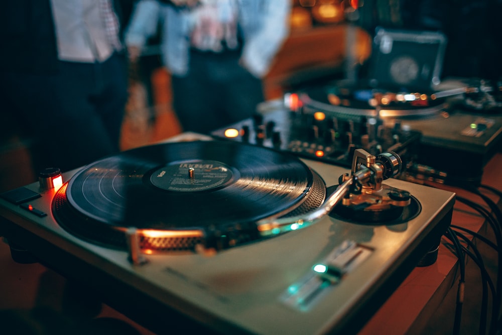 selective focus photography of turntable