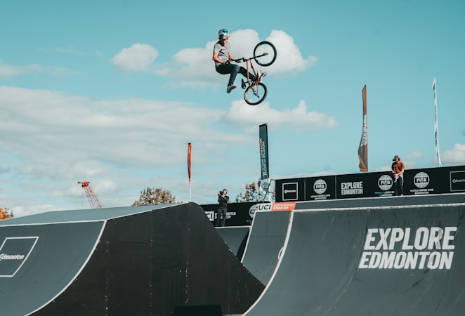 Freestyle BMX rider mid air above a ramp, the kind of stunt used to open the you matter school assemblies
