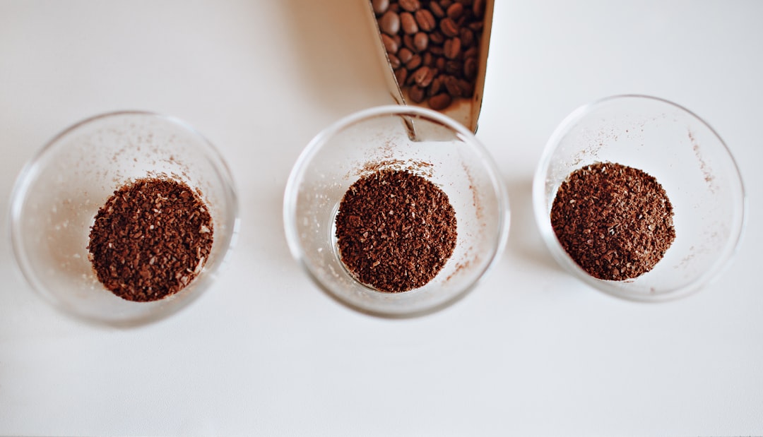 three clear glass cup filled with coffee grains