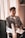 smiling man sitting on chair inside room