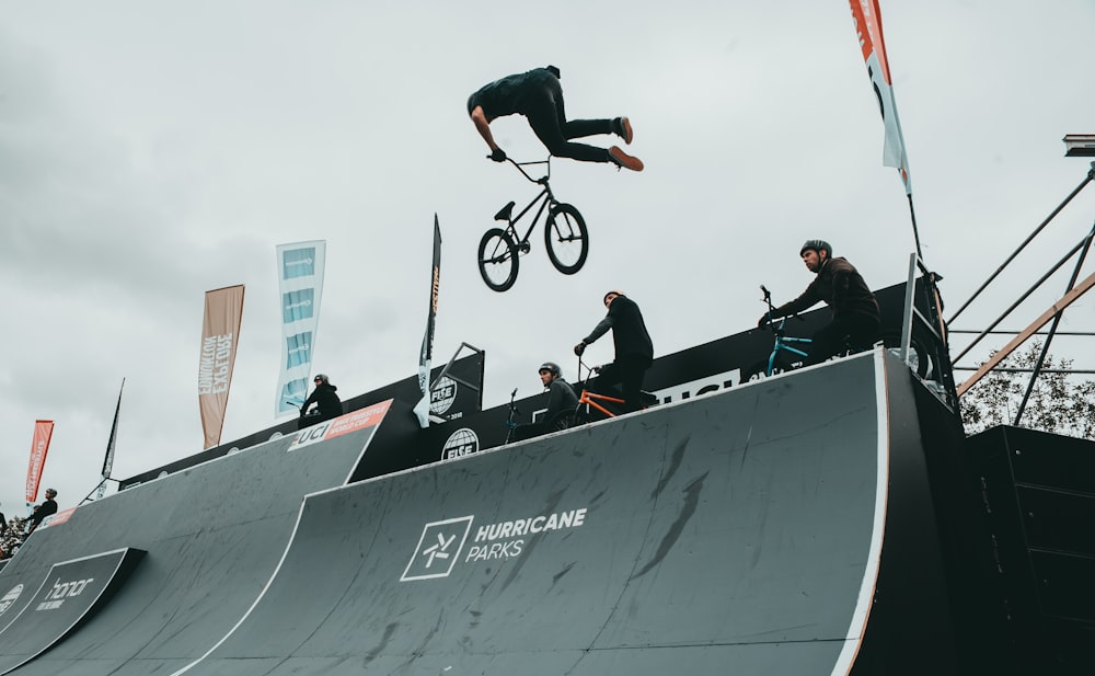 man doing freestyle bicycle on mid-air