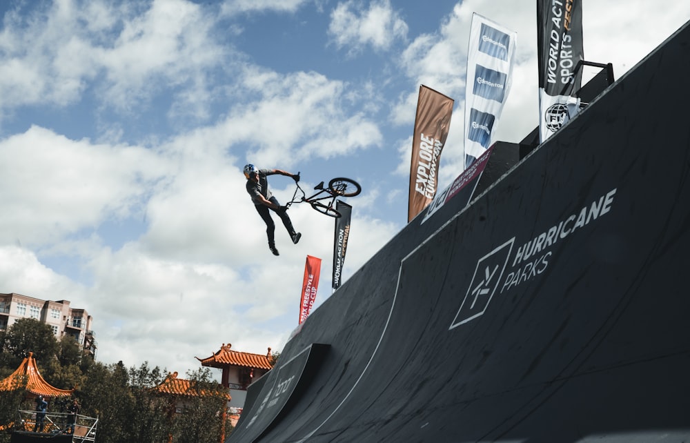 man doing bicycle trick