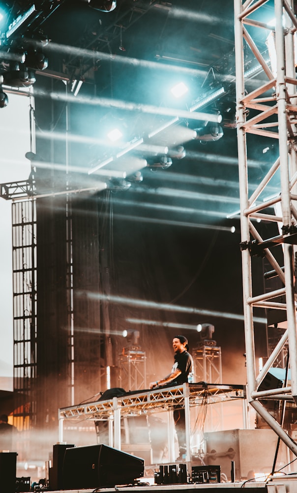 man standing while playing music