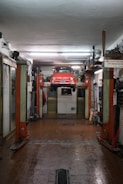 Photo of a modern garage equipped with heavy-duty automotive lifts
