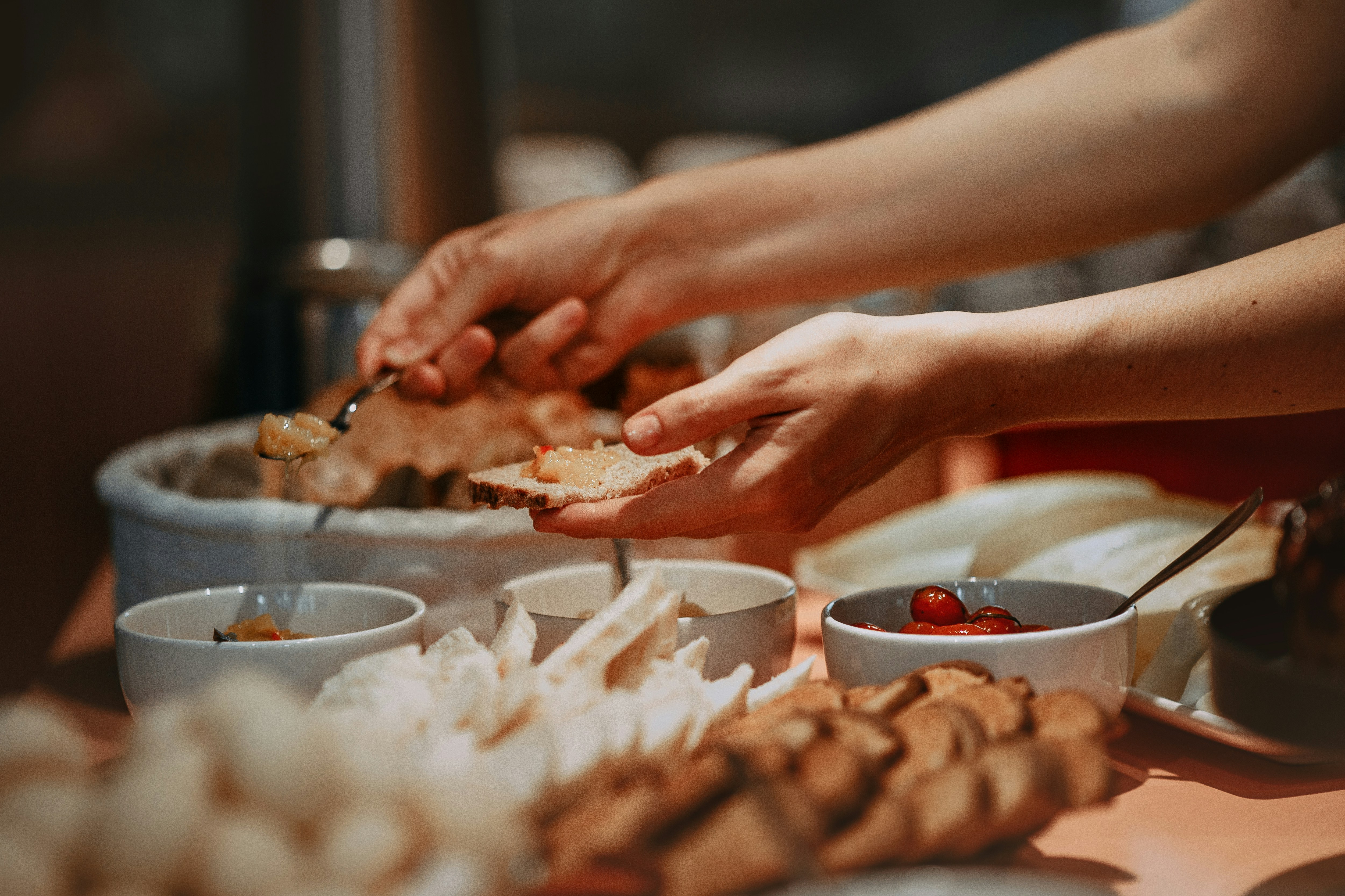 person preparing sandwich