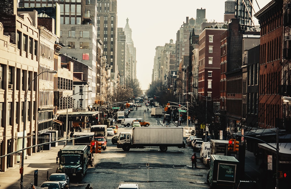 different cars on road near buildings