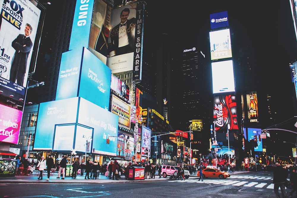 people walking on street during nighttime