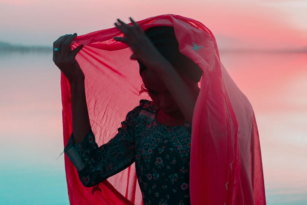 woman covering body using scarf