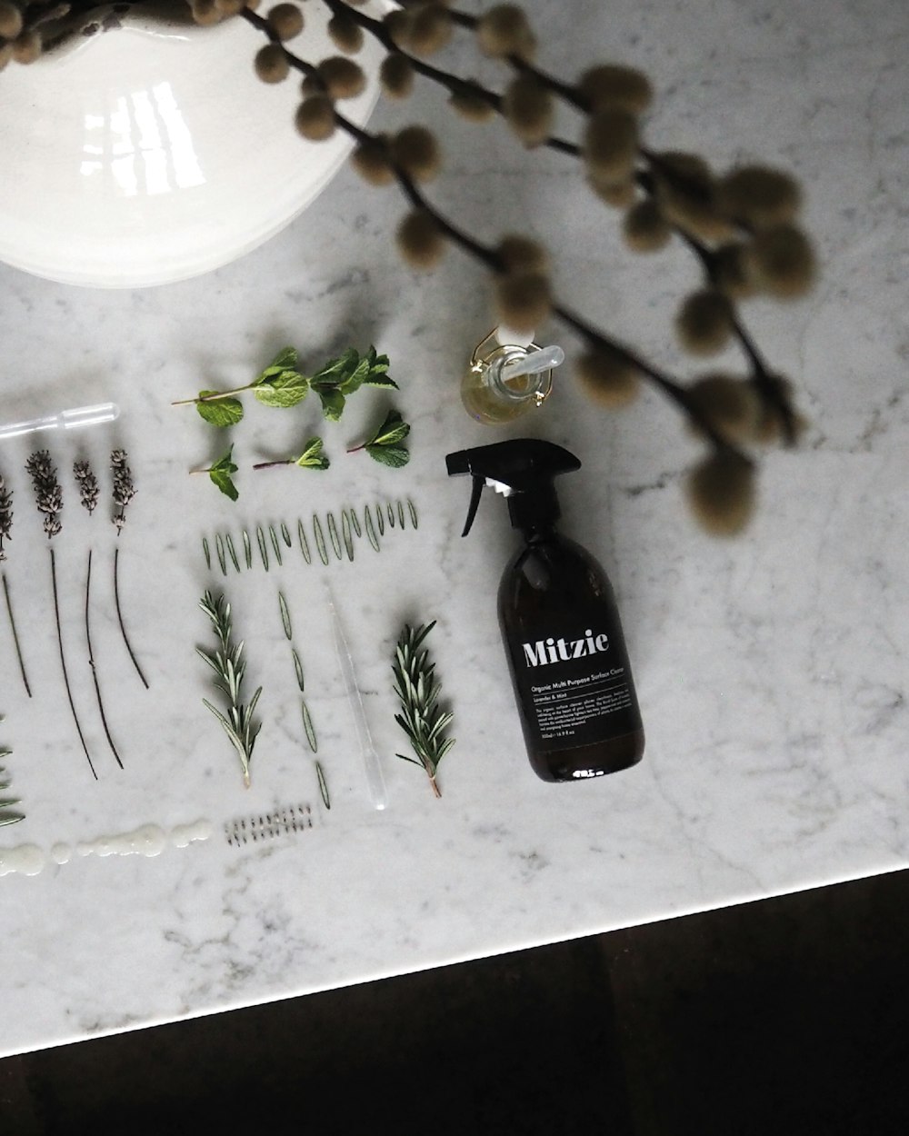 black Mitzie spray bottle on sink