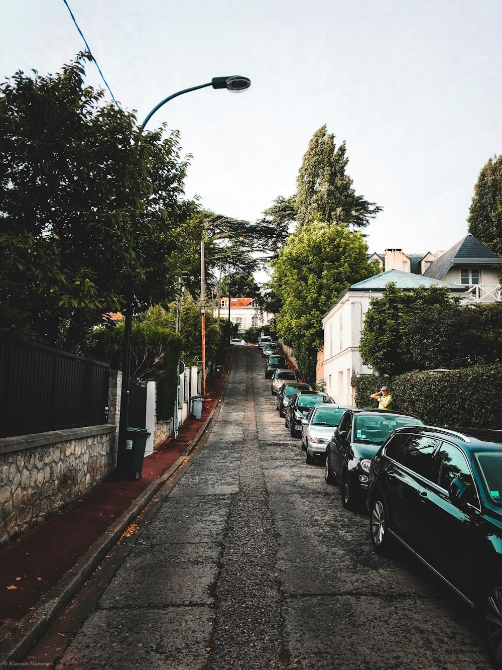 lined of cars parked under blue sky