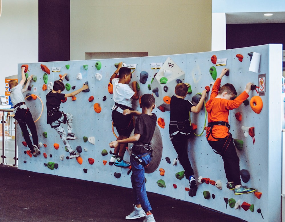kids on test climb rock