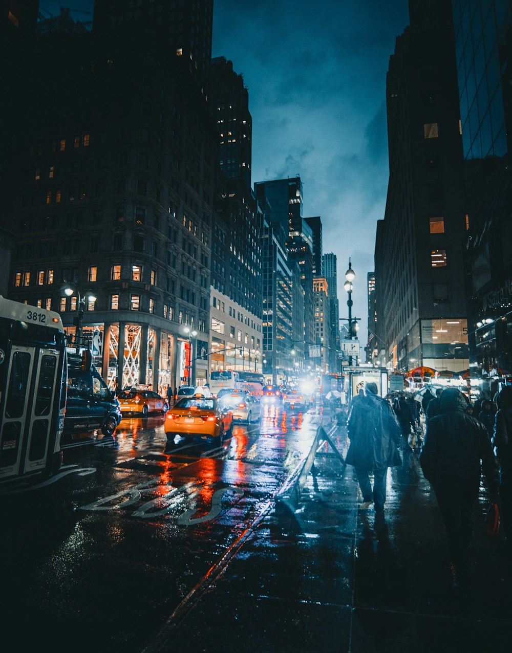 people walking on street at nighttime
