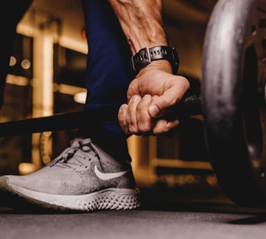 person about to lift barbell