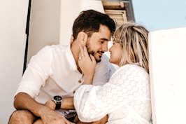 smiling man and woman about to kiss