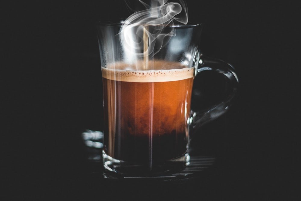 chocolate drink in clear glass mug