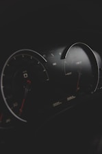 black and gray vehicle cluster panel displaying at 0