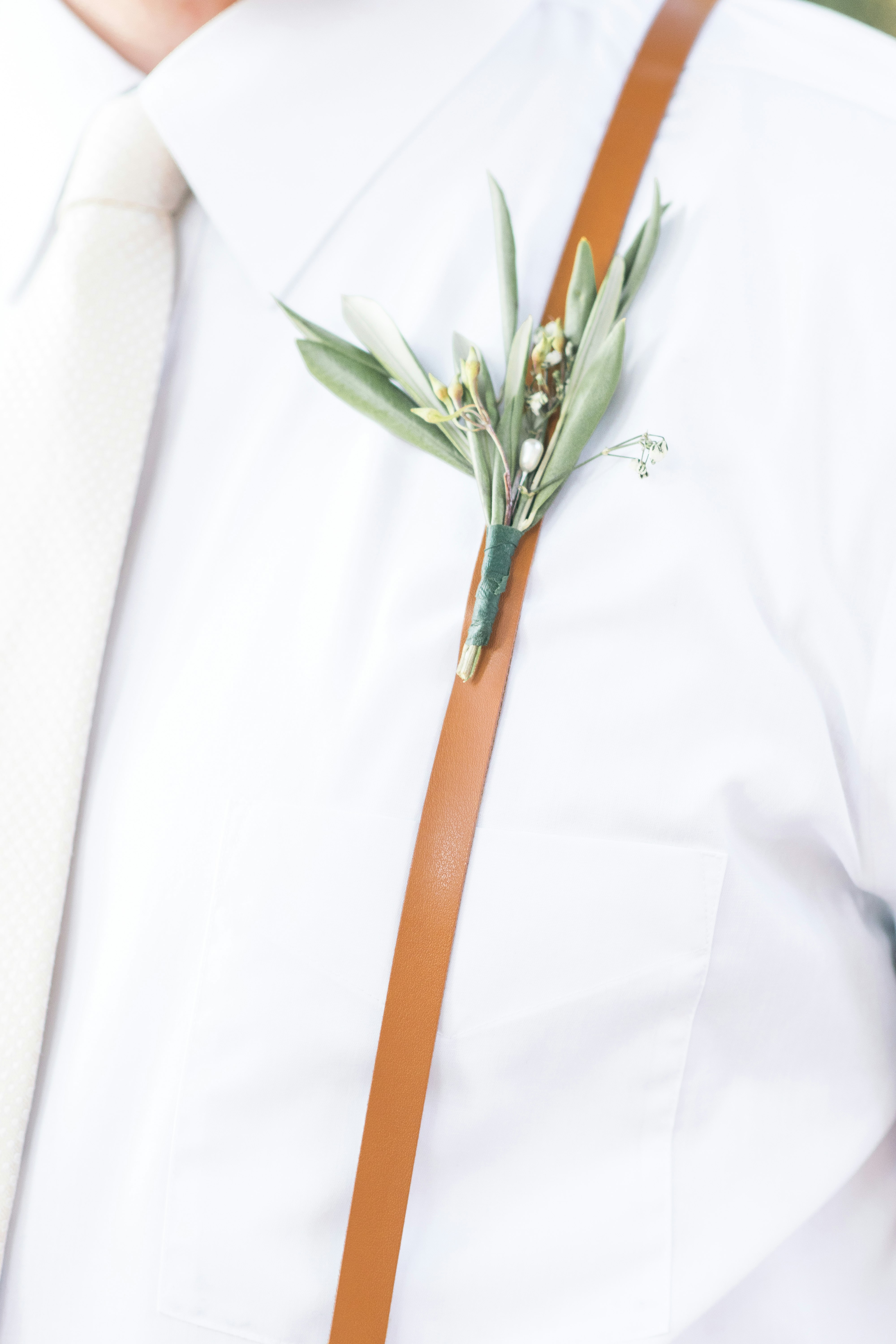 person wearing flower brooch