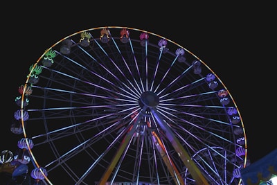 A giant Ferris wheel illuminated at night, offering stunning views.