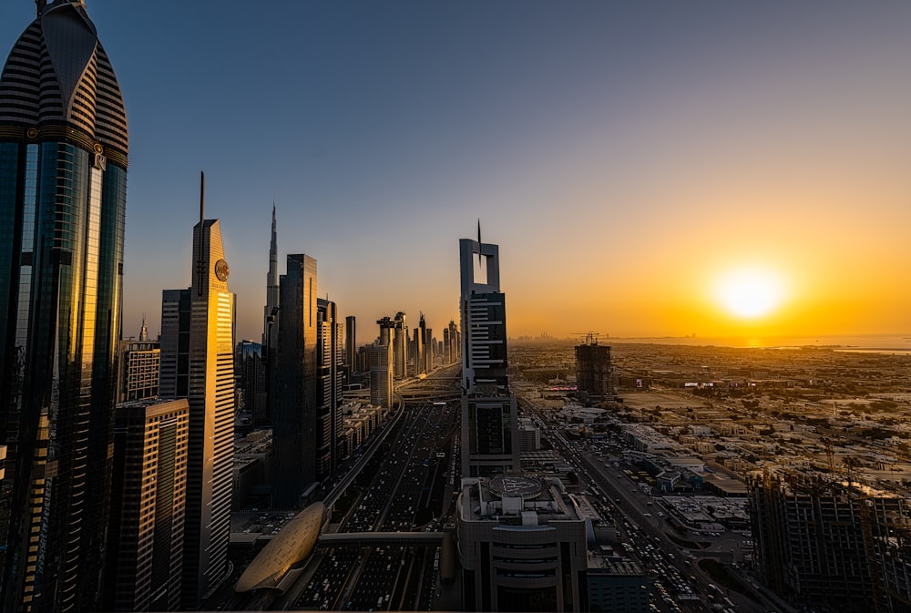 sunset over the city with high rise buildings