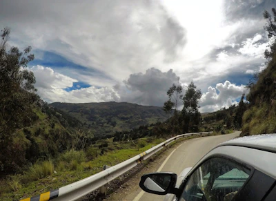 A scenic mountain landscape with a winding road inviting adventure.