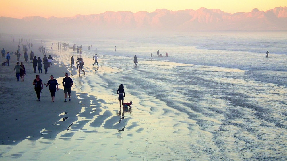 people walking on field covered with snow